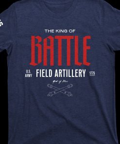 King Of Battle T-Shirt - a dark denim blue short sleeved T-Shirt with the text "Battle" in bold red across the center of the chest - above battle in smaller white text reads "The King Of" Underneath "Battle" reads in also smaller white text "US Army - Field Artillery - 1775