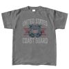 A dark gray t-shirt featuring the united states coast guard emblem in the center eith the text "united states" above it and "coast Guard" below it. the emblem features the colors, red, blue, and white. the text color is also white