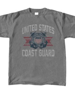 A dark gray t-shirt featuring the united states coast guard emblem in the center eith the text "united states" above it and "coast Guard" below it. the emblem features the colors, red, blue, and white. the text color is also white