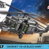COBI UH-60 Black Hawk - From a set of 905 COBI construction blocks, you can build an extremely popular American SIKORSKY® UH-60 BLACK HAWK® helicopter, accurately reproduced in 1:32 scale. The helicopter was released under the license of the American company Sikorsky Aircraft Corporation. Black Hawk helicopters are produced e.g. in Mielec (Poland) right next to the COBI bricks factory! The set was released in the Armed Forces series, in which we present machines currently used in the armies of the world. Measuring up to 53.5 cm in length, the model has been covered with high-quality prints that do not wear out even during intensive use. The helicopter is equipped with spinning propellers, sliding doors and a machine gun just behind the cockpit. The set includes two figures of American pilots. The whole set is completed with a brick with the name of the set and the Sikorsky logo printed on it. The set is ideal for enthusiasts of modern military equipment and slightly older constructors who value realistic models. The helicopter, which is constantly being talked about in the world, will be an interesting element of the collection, next to which it is impossible to pass by indifferently.