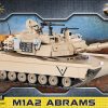 COBI M1A2 Abrams Tank - From the world of COBI comes a model of the Abrams M1A2. The model has been mapped on a sensational scale of 1:35. High-quality prints add to the fantastic detail of this model. The vehicle has a working track and opening hatches where you can place the crewmen. The vehicle tower and barrel both move The Abrams has been enriched with numerous additions such as sacks, spare tracks, a petrol canister and two machine guns. The opening flap allows access to the engine recreated from the bricks. The set is accompanied by a figure of an American Tank personnel who is equipped with binoculars & helmet.
