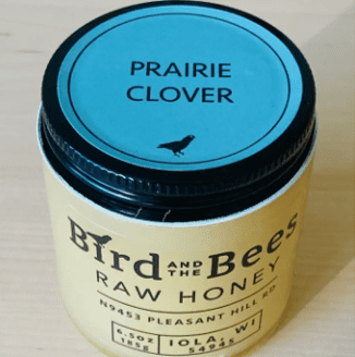 6.5 oz glass jar of raw honey by Bird and the Bees Apiary. Prairie clover flavor with a hint of cinnamon.