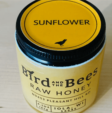From Bird and the Bees Apiary in Iola Wisconsin. This is a 6.5 ounce glass jar of Sunflower flavored Honey. It has a creamy buttery flavor that is noticable but not overwhelming.