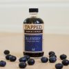 8 ounce glass bottle of blueberry infused maple syrup by Tapped
