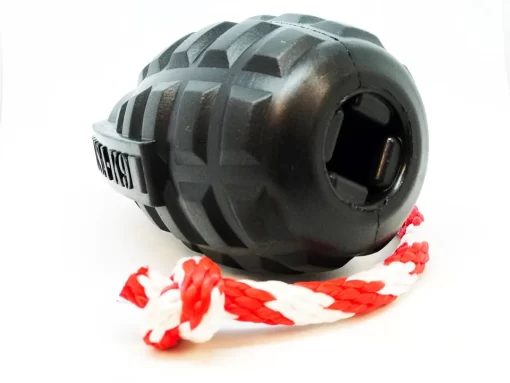 back view of the black grenade tug toy, showing the hole that can be used to stuff the toy with treats or dog safe peanut butter