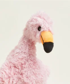 Close up of a Warmies pink flamingo plush stuffed animal from body up.